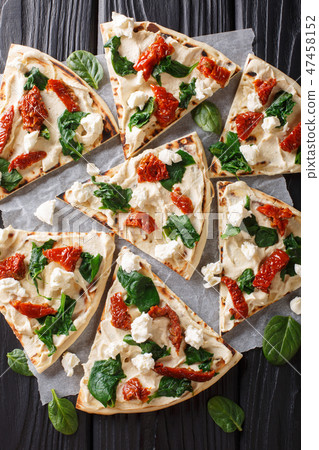 Freshly baked flatbread with hummus 47458152