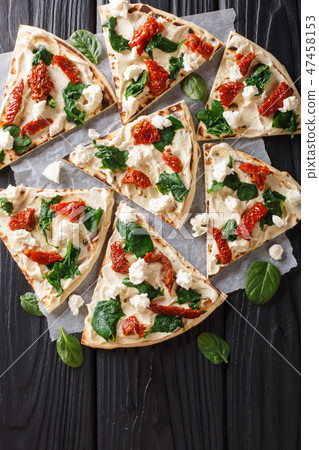 Flat bread with hummus, sun-dried tomatoes Flat bread with hummus, sun-dried tomatoes 47458153