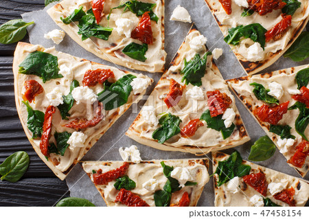 Freshly baked flatbread with hummus 47458154