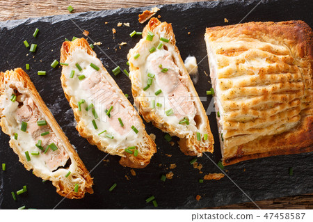 Baked salmon pie with cheese close-up Baked salmon pie with cheese close-up 47458587