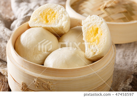 Chinese traditional steam custard buns closeup Chinese traditional steam custard buns closeup 47458597