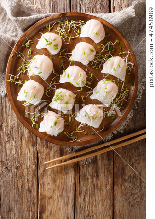 Chinese dim sum with shrimps with microgreen Chinese dim sum with shrimps with microgreen 47458989