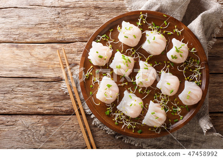Chinese dim sum with shrimp served with microgreen 47458992