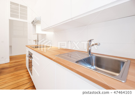 kitchen sink water tap in new white kitchenette  47464103