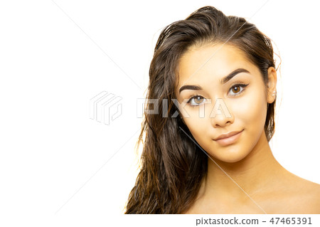 Mixed race young woman face portrait isolated on white background. 47465391