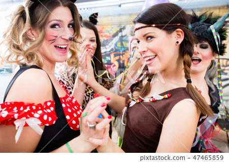 Young German women at fasching carnival having costume party 47465859