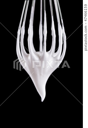 Metal whisk with whipped egg whites, isolated on black background. Clipping path. Metal whisk with whipped egg whites, isolated on black background. Clipping path. 47466159
