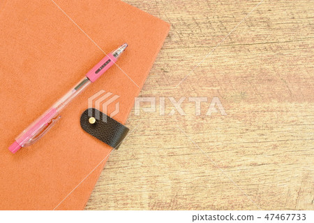 diary book and pen on wooden table 47467733