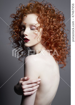 Beautiful nude woman with red-hair and red lips. 47467956