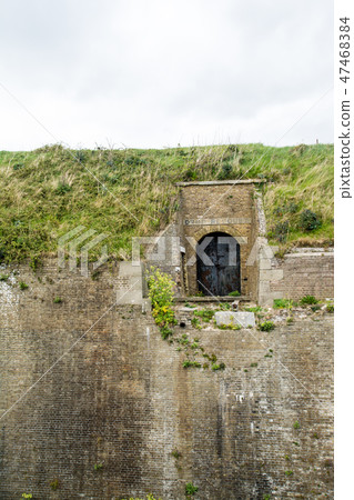 Dover's old fortress The iron doors arriving at the moat and the brick building Dover's old fortress The iron doors arriving at the moat and the brick building 47468384