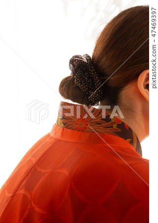 A woman wearing a woman wearing a red kimono Kimono A woman wearing a woman wearing a red kimono Kimono 47469397