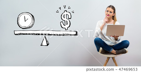 Time and money on the scale with young woman using her laptop Time and money on the scale with young woman using her laptop 47469653