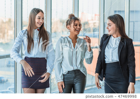 Three business girls chatting smiling when they succeed in business. Teamwork Ideas to organize and 47469998