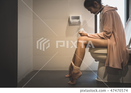 woman in toilet woman in toilet 47470574