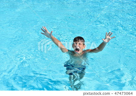 The boy drowns in the water and calls for help The boy drowns in the water and calls for help 47473064