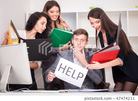 frustrated attractive businessman in her 20s holding help sign desparate suffering stress overworked 47474211