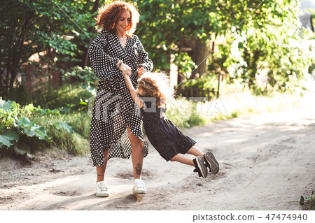 Mom and little daughter are having fun and playing Mom and little daughter are having fun and playing 47474940