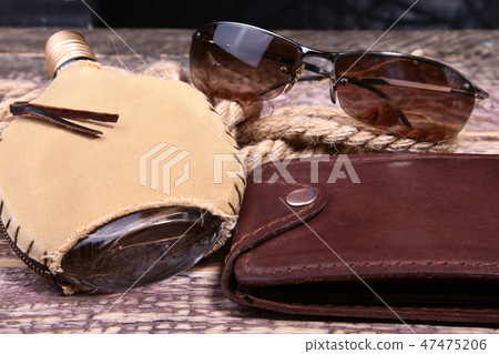 Stylish mens business accessories. Watch, wallet, bottle with cologne on wooden background. Stylish mens business accessories. Watch, wallet, bottle with cologne on wooden background. 47475206