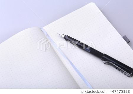 office table with notebook and pen. copy space. 47475358