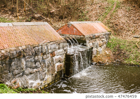 Little dam in Lithuanian creek in Kaliningrad 47476459
