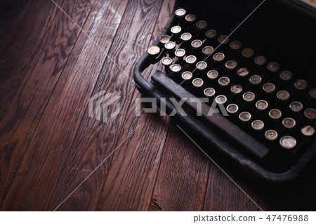 Old retro vintage typewriter on wooden board Old retro vintage typewriter on wooden board 47476988