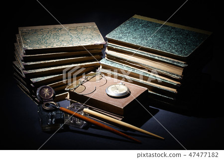 old books, papers, ink pen and inkpot 47477182