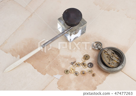 old papers and pen with broken pocket watch old papers and pen with broken pocket watch 47477263
