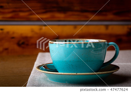 Beautiful Delicious Latte art, Blue coffee cup on wooden background. Beautiful Delicious Latte art, Blue coffee cup on wooden background. 47477624