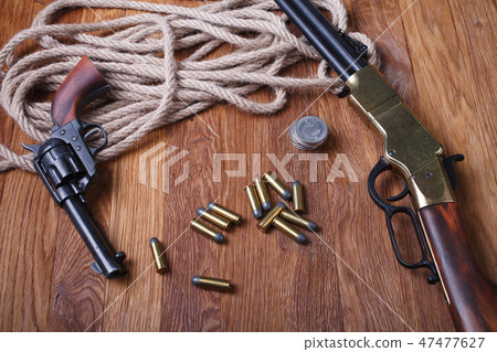 Wild west rifle, ammunition and silver dollars Wild west rifle, ammunition and silver dollars 47477627