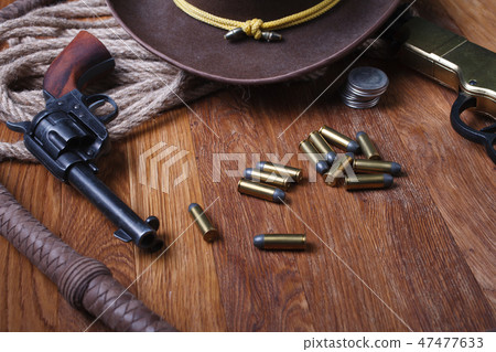 Wild west guns, ammunition and silver dollars Wild west guns, ammunition and silver dollars 47477633