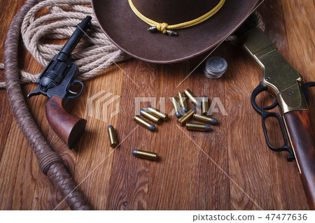 Wild west guns, ammunition and silver dollars Wild west guns, ammunition and silver dollars 47477636