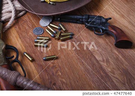 Wild west guns, ammunition and silver dollars 47477640