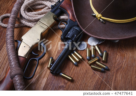 Wild west guns, ammunition and silver dollars Wild west guns, ammunition and silver dollars 47477641