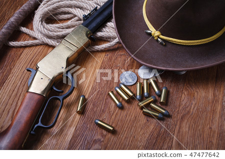 Wild west rifle, ammunition and silver dollars Wild west rifle, ammunition and silver dollars 47477642