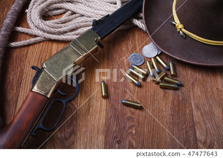 Wild west rifle, ammunition and silver dollars 47477643