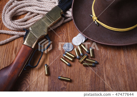 Wild west rifle, ammunition and silver dollars Wild west rifle, ammunition and silver dollars 47477644
