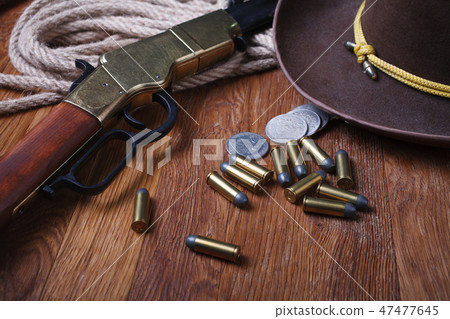 Wild west rifle, ammunition and silver dollars Wild west rifle, ammunition and silver dollars 47477645
