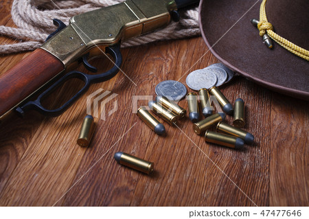 Wild west rifle, ammunition and silver dollars Wild west rifle, ammunition and silver dollars 47477646