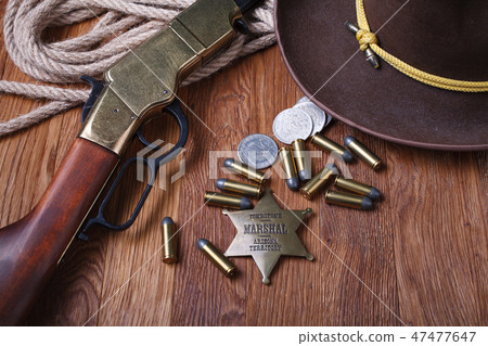 Wild west rifle, ammunition and sheriff badge Wild west rifle, ammunition and sheriff badge 47477647