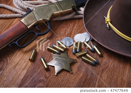 Wild west rifle, ammunition and sheriff badge Wild west rifle, ammunition and sheriff badge 47477649