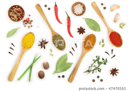mix of spices in wooden spoon isolated on a white background. Top view. Flat lay. Set or collection 47478581