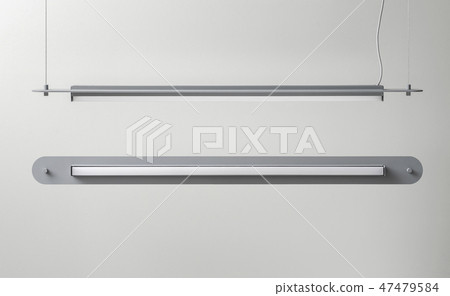 Gray metal lamps hanging on light wall background in studio 47479584