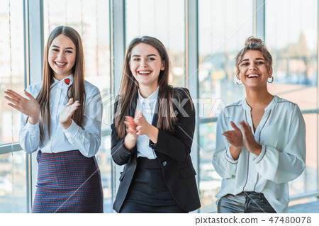 Three businesswomen working in the office. Positive workplace concept. Three businesswomen working in the office. Positive workplace concept. 47480078