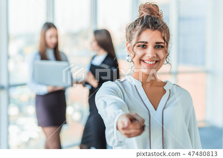 The business lady in the office giving his consent to the signing of a contract stretches out his 47480813