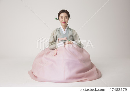 Korean beauty concept photo. Young beautiful woman wearing Hanbok, Korean traditional dress. 275 47482279