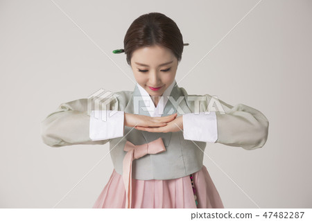 Korean beauty concept photo. Young beautiful woman wearing Hanbok, Korean traditional dress. 273 47482287