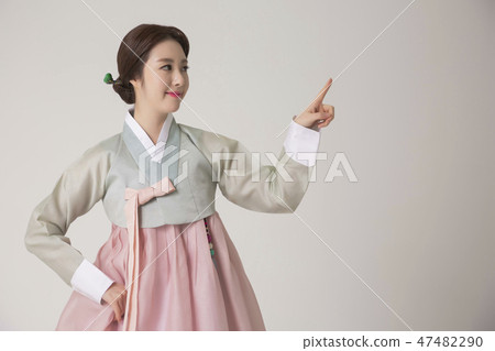 Korean beauty concept photo. Young beautiful woman wearing Hanbok, Korean traditional dress. 265 47482290