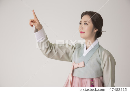 Korean beauty concept photo. Young beautiful woman wearing Hanbok, Korean traditional dress. 261 Korean beauty concept photo. Young beautiful woman wearing Hanbok, Korean traditional dress. 261 47482315