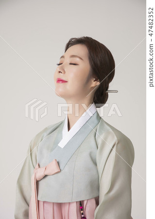 Korean beauty concept photo. Young beautiful woman wearing Hanbok, Korean traditional dress. 245 47482352