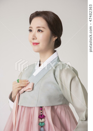 Korean beauty concept photo. Young beautiful woman wearing Hanbok, Korean traditional dress. 205 47482363